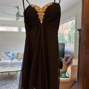 Elegant Black Dress with Embellished Neckline